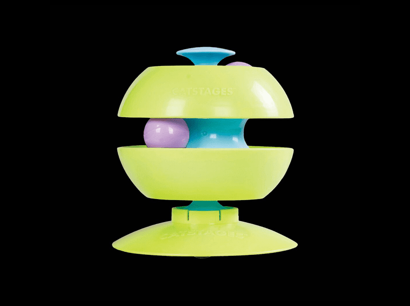 Green toy with purple balls and blue center.