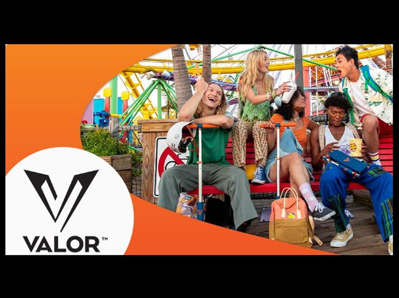 Group enjoying amusement park with Valor logo.