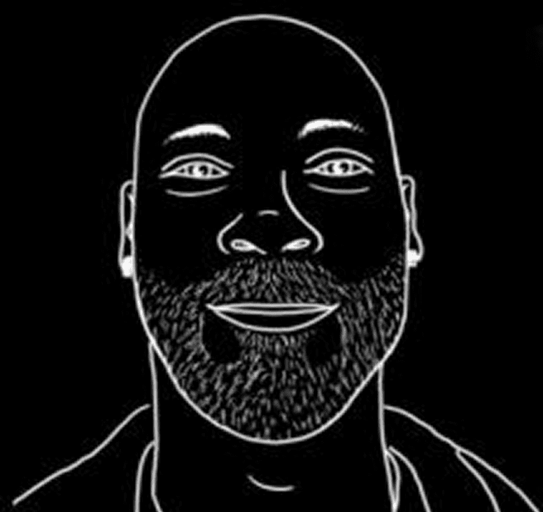 Outlined face on black background, bearded man.